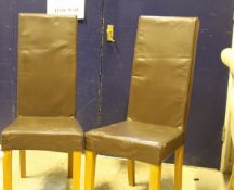 A set of four modern leather effect dining chairs, a modern rectangular coffee table,