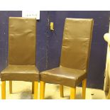 A set of four modern leather effect dining chairs, a modern rectangular coffee table,