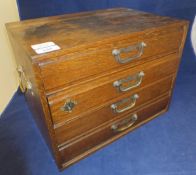 A circa 1900 oak table top chest of four drawers,