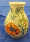 A Moorcroft vase decorated with poppies, inscribed to base "Trial 14.3.