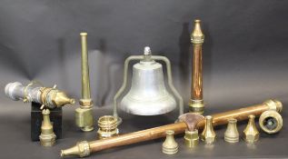 A collection of vintage copper and brass fire branch pipes and nozzles including a long branch pipe