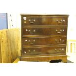 A reproduction mahogany chest of four graduated drawers on bracket feet and an Indian hardwood