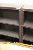 Two leather covered four shelf open bookcases