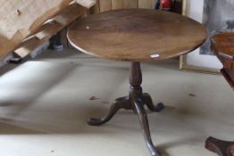 A Victorian oak tilt-top table,