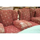 A 1940's three piece suite comprising a two-seater sofa and two armchairs,