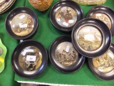 A collection of seven 19th Century Prattware pot lids,