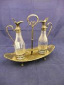 A George V facet cut glass and silver mounted oil and vinegar bottle on stand (by Millar Wilkinson,