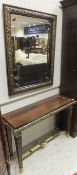 A reproduction mahogany and brass mounted side table in the Louis XV manner with matching mirror