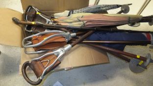 A collection of seven various shooting sticks, three parasols,