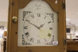 A pine long case clock with Quartz movement