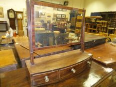 An early 19th Century mahogany and satinwood strung toilet mirror,