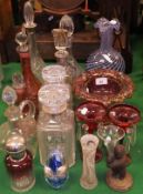 A selection of glass to include cranberry glass, a Black Forest bear decorated vase,