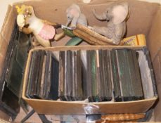 A box containing an assortment of sundry figures and a collection of 19th Century magic lantern