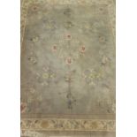 A Chinese superwash rug in light grey,