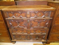 An early 20th Century oak chest in the Jacobean style,