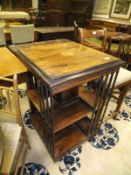 A Victorian rosewood two tier revolving bookcase with inlay to top,