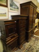 A mahogany two door wardrobe with bank of four short drawers, to bracket feet,