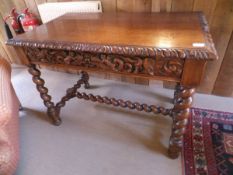A carved oak single drawer side table,