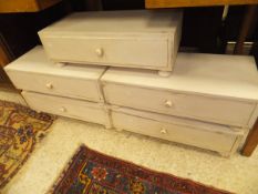 A set of five modern painted single drawer chests on bun feet