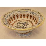 A 19th Century polychrome decorated Delft ware pedestal bowl of large proportions painted with a