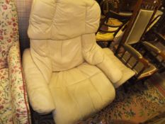 An Ekornes Stressless leather upholstered armchair and stool and a circa 1900 stained beech framed