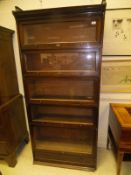 A pair of Lebus stained beech five section bookcases in the Globe Wernicke manner,