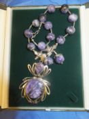 A mexican silver and purple agate necklace with bead and starfish decoration,