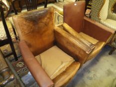 A pair of Edwardian brass studded leather upholstered armchairs