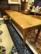 A circa 1900 oak side table, the plain top above two single drawers,