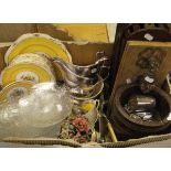 A box containing an Indian treen ware mortar, brass hand door knocker, various plated wares,