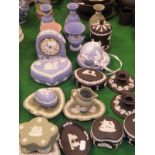 A collection of Wedgwood Jasper ware in pale blue, green, black and pink, to include vases, clock,
