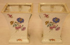 A pair of 18th Century porcelain bough pots of square flared form with relief basketweave