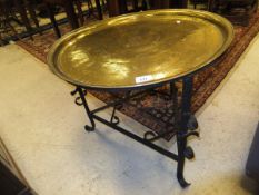 A brass topped Benares style table with painted metal base