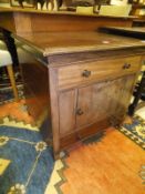 A 19th Century mahogany night table with single drawer over cupboard door and a further drawer on