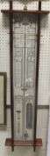 A 20th Century copy of an Admiral Fitzroy mercury barometer / thermometer with atmosphere gauge,