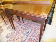 A circa 1900 mahogany fold-over tea table of plain form,