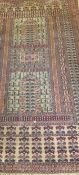 A Persian prayer rug, the central panel set with two pillars, both on a beige ground, within blue,