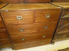 An early 20th Century mahogany military style chest in two sections,