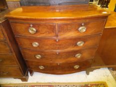 An early Victorian mahogany bow fronted chest of two short over three long graduated drawers to