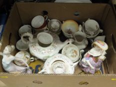 Two boxes of assorted decorative china wares to include tea wares, figurines, etc,