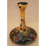 A Moorcroft pottery vase of squat guglet vase form, decorated with butterflies, spider,