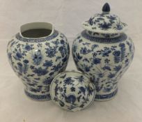 A pair of 19th Century Chinese lidded baluster shaped vases with acorn style finial to the cover,