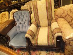 An early Victorian upholstered mahogany show frame library armchair on baluster turned and ringed