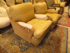 A pair of early to mid 20th Century Howard style upholstered armchairs