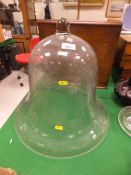 A large Victorian glass bell-shaped cloche