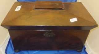 A late Regency rosewood tea caddy of sarcophagus form,