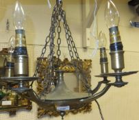 A five branch brass chandelier and a hanging oil lamp (no shade)