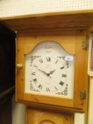 A pine long case clock with Quartz movement