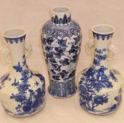 A Chinese porcelain baluster shaped vase decorated in blue and white with butterflies and scrolling