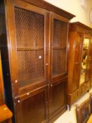 An OKA stained cherrywood two section bookcase,